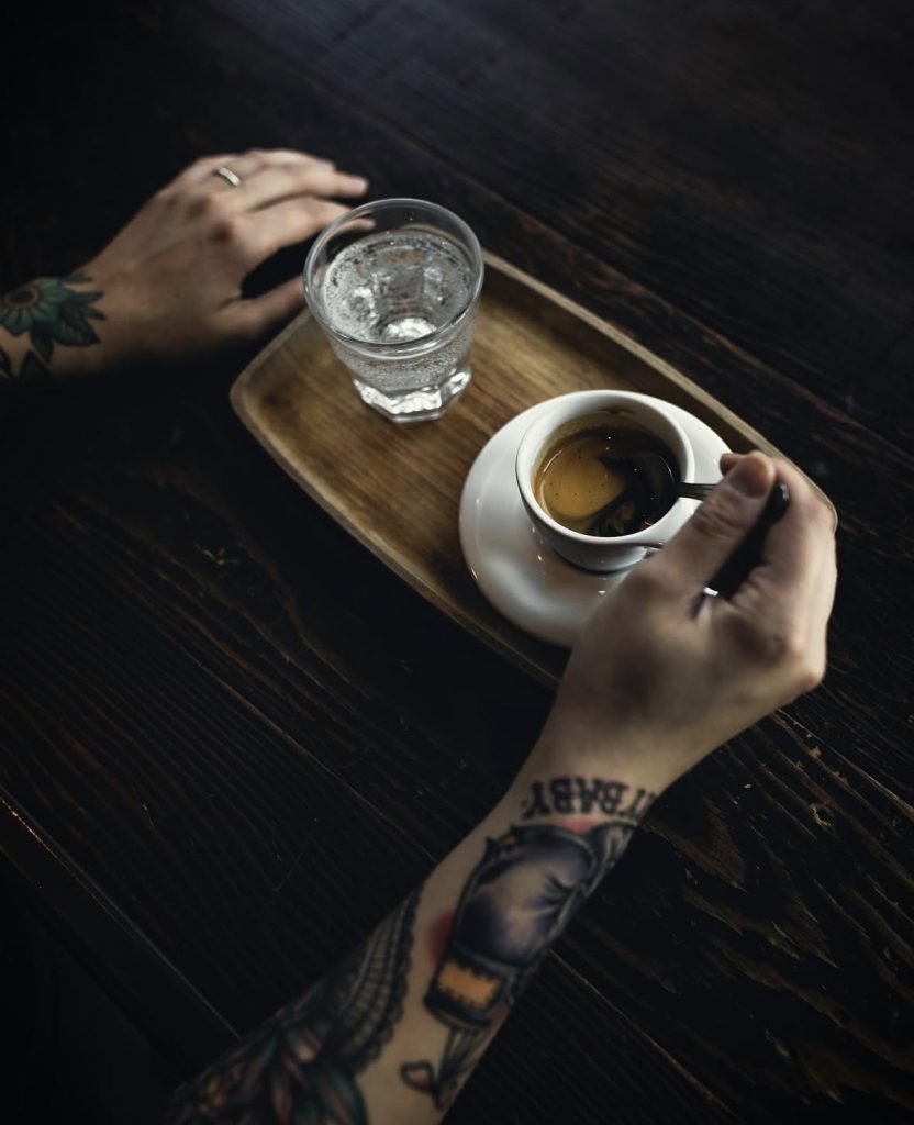 small cup of coffee and mineral water