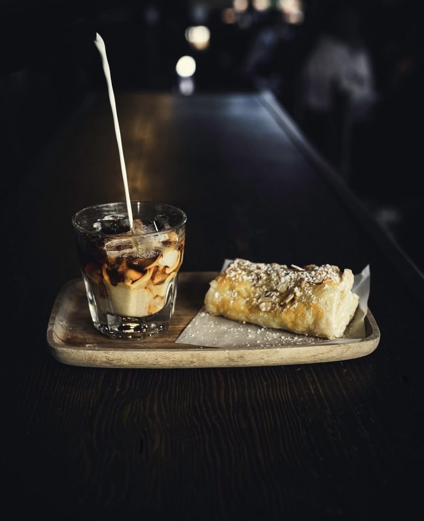 large glass of coffee and pastry