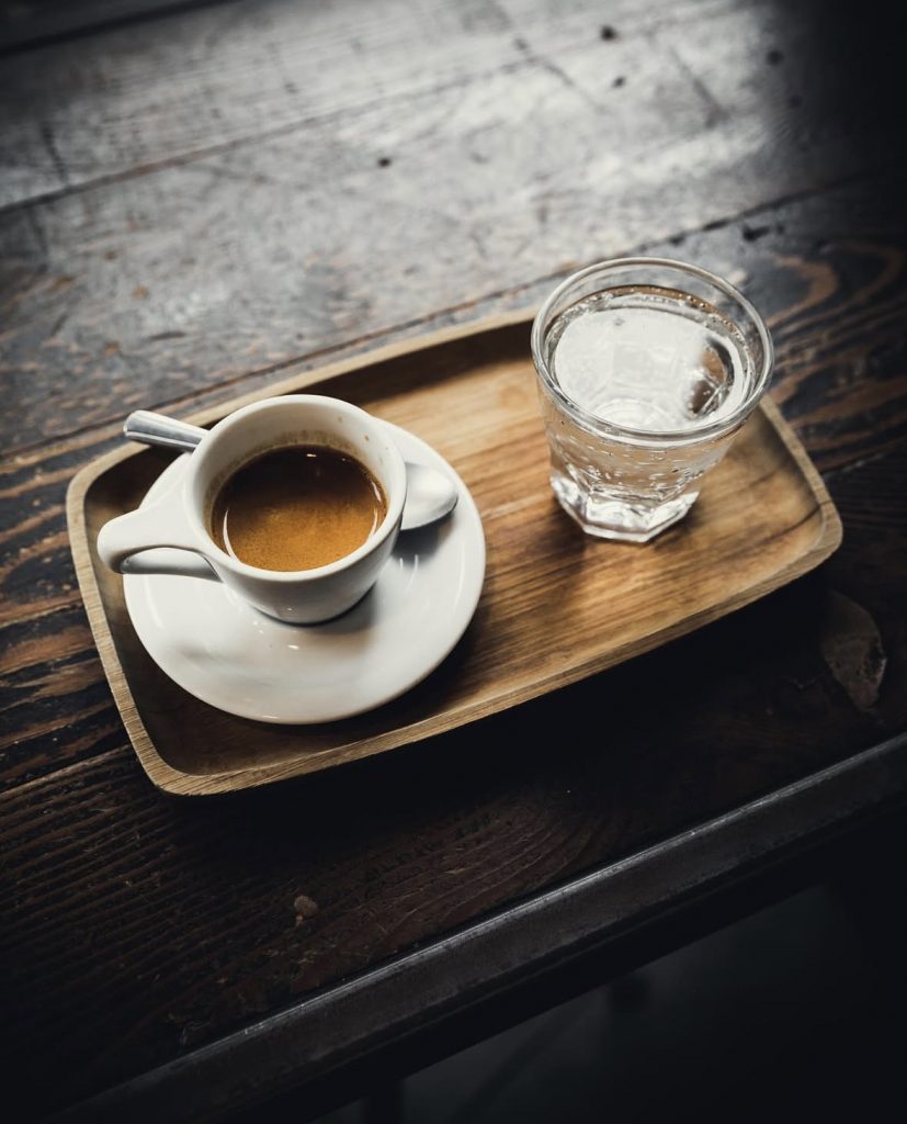 small cup of coffee and mineral water
