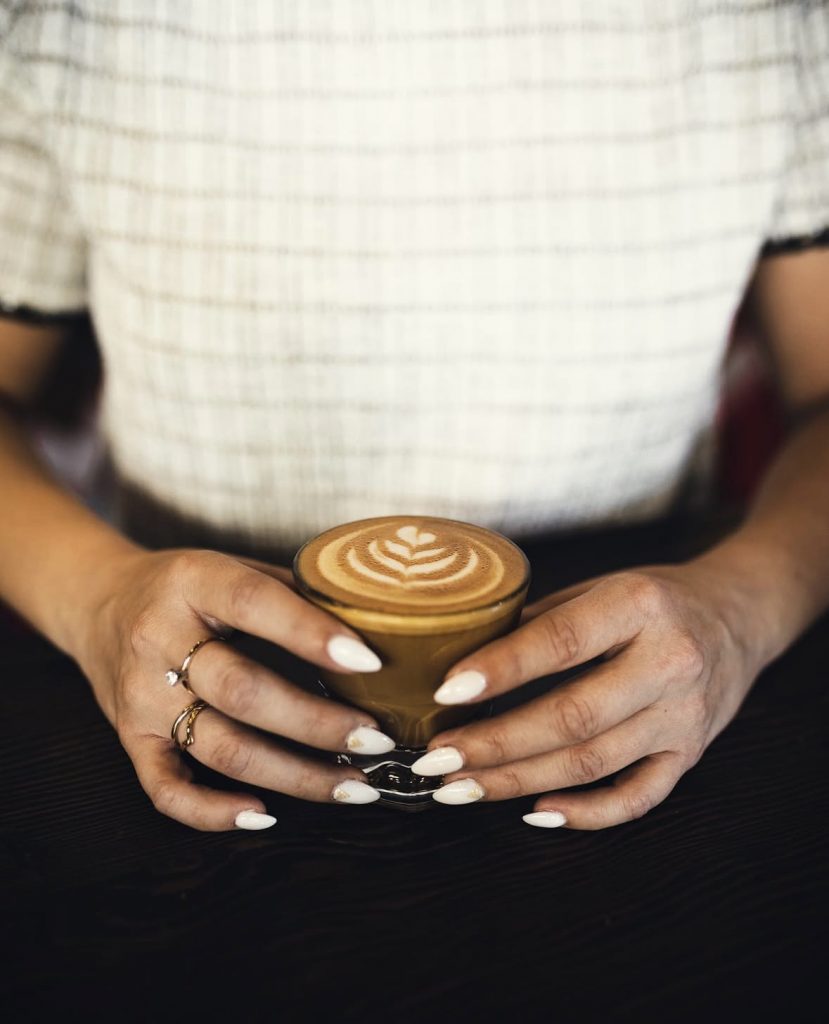 small cup of coffee and nails