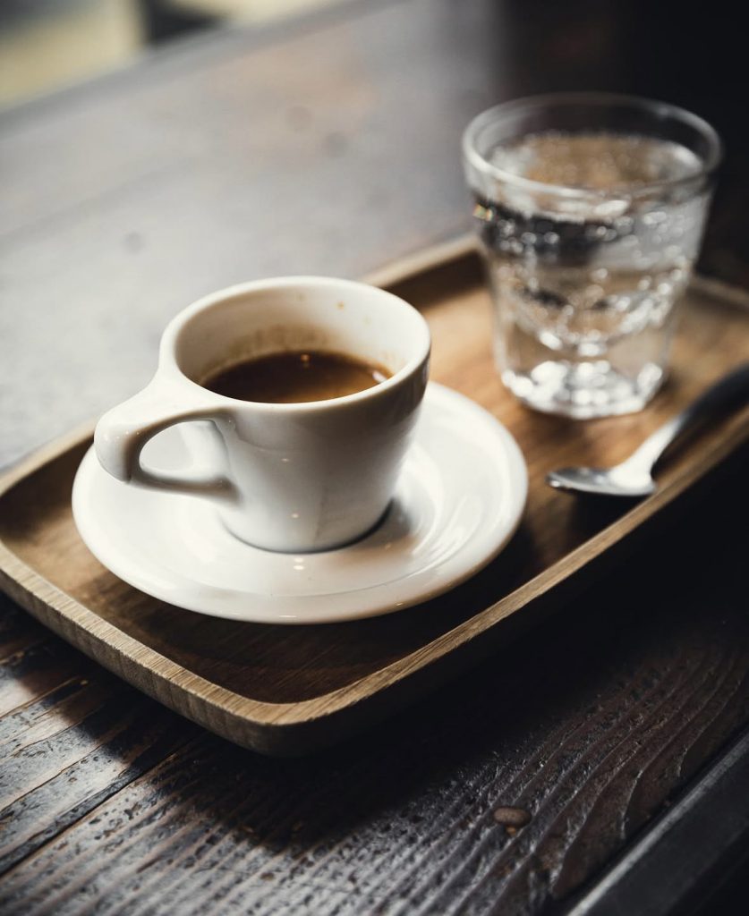 small cup of coffee and mineral water
